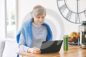 Indoor portrait of happy middle age woman