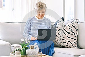 Indoor portrait of happy middle age woman