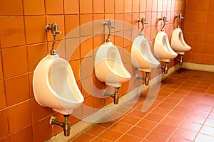 Indoor public restroom urinals for men