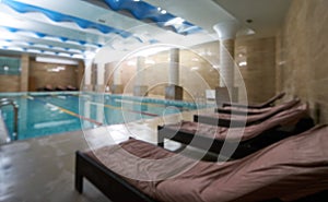 Indoor public swimming pool interior in fitness gym club