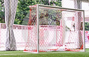 Indoor soccer goal on artifact grass field