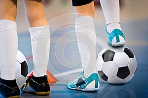 Indoor soccer players training with balls. Indoor soccer sports hall. Football futsal player, ball, futsal floor