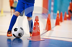 Indoor soccer players training with balls. Indoor soccer sports hall. Indoor football futsal player