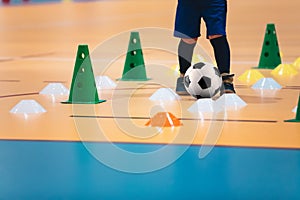 Indoor soccer players training with balls. Indoor soccer sports hall. Futsal league