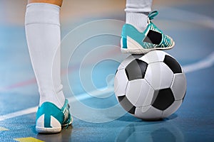 Indoor soccer sports hall. Football futsal player, ball, futsal floor. Sports background. Youth futsal league.