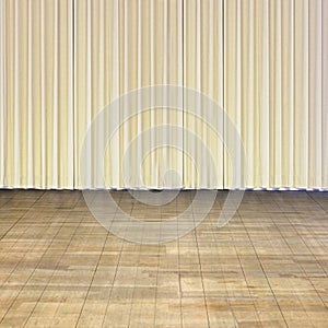 Indoor stage with old wood floor and beige curtain