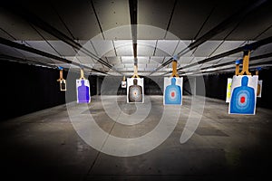 Indoor target shooting range looking down range at targets