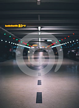 Indoor underground parking lot with blurred background low shot and perspective