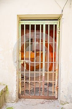 Indoor view with a door with bars, in the old prison Penal Garcia Moreno in the city of Quito photo