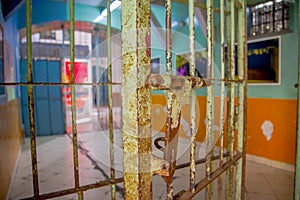 Indoor view of old deserted rugged cell for prisioners, in the old prison Penal Garcia Moreno in the city of Quito photo