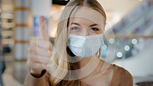 Indoors portrait caucasian woman patient girl female lady in face protective medical mask protecting health from