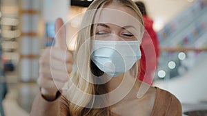 Indoors portrait caucasian woman patient girl female lady in face protective medical mask protecting health from