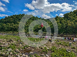 Indore, Madhya Pradesh, India- September 29, 2019: Peoples enjoy bathing in the Choral river and exploring Kalakund tourist spot.