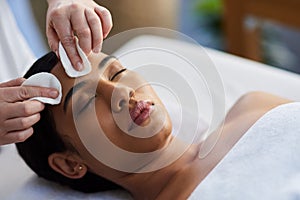 Indulge in a de-stressing day at a beauty spa. an attractive young woman getting a massage at a spa.