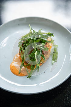 Crab Cake Dinner Recipe: Savor the Delight of Succulent Crab Cakes, Served with a Refreshing Rocket Salad