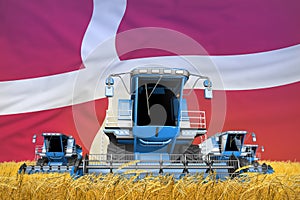 Industrial 3D illustration of four light blue combine harvesters on rural field with flag background, Denmark agriculture concept