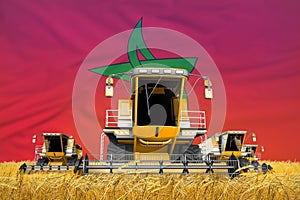 Industrial 3D illustration of four orange combine harvesters on farm field with flag background, Morocco agriculture concept