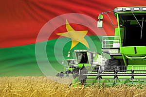 industrial 3D illustration of three green modern combine harvesters with Burkina Faso flag on rural field - close view, farming