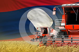 industrial 3D illustration of three red modern combine harvesters with Lao People Democratic Republic flag on grain field - close