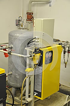 The industrial air compressor in the workshop