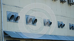 industrial air conditioner. Air conditioner units HVAC on a roof of industrial building with blue sky and clouds in the