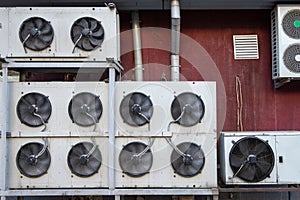 Industrial air conditioning and ventilation systems on the wall of a building