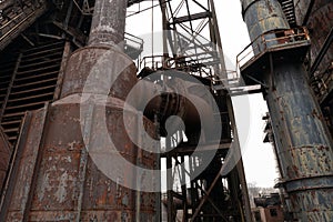 Industrial architecture with heavy metal structure, rusting decay