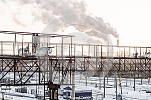 Industrial area railway station with smoking chimney