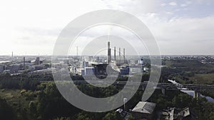 Industrial area and smoking chimney on power plant near the city. landscape. Stock footage. Smoke staks from boiler