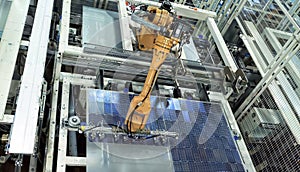 Industrial assembly line in a factory. Production of solar panels.