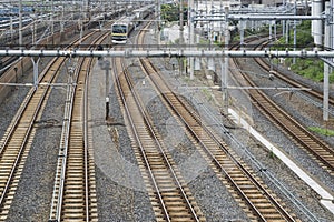 Industrial background featuring detail of electrical railroad with rails and contact lines