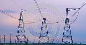 Industrial background group silhouette of transmission towers or power tower, electricity pylon, steel lattice tower at