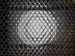 Industrial background of the mesh surface of the desktop from the machine