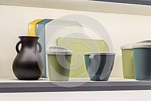 Industrial background with plastic products. Various containers for storing food on the shelf for sale in the store