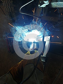 Industrial background smoke and sparks from resistance welding