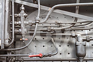 Industrial background - view of the mechanical units of an old steam locomotive, piece of machinery