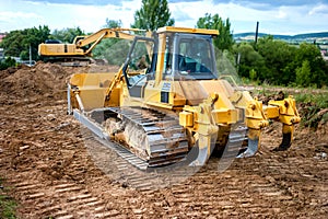 industrial backhoe truck moving earth and soil in quarry constru