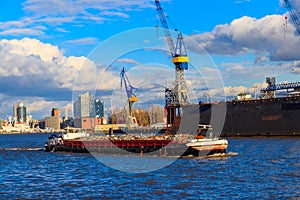 Industrial barge carrying scrap metal for recycling on the river Elbe in Hamburg, Germany