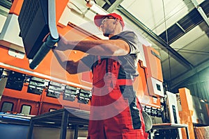 Industrial Bending Machine Operator at Work