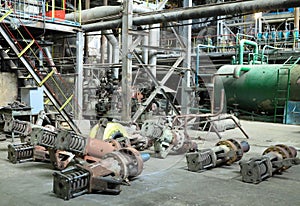 Industrial big water pumps with electric motors, pipes, tubes, equipment and steam turbine at power plant