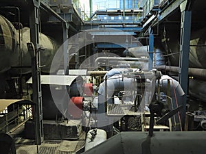 Industrial big water pumps with electric motors, pipes, tubes, equipment and steam turbine at power plant