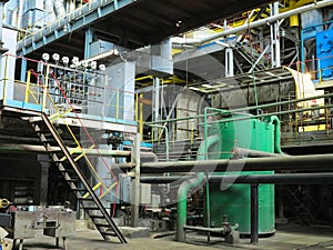 Industrial big water pumps with electric motors, pipes, tubes, equipment and steam turbine at power plant