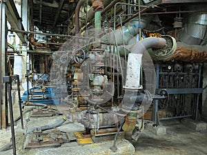 Industrial big water pumps with electric motors, pipes, tubes, equipment and steam turbine at power plant