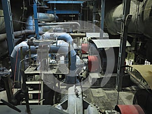 Industrial big water pumps with electric motors, pipes, tubes, equipment and steam turbine at power plant