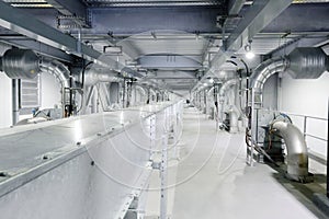 Industrial blowers  and enclosed conveyor line in a food processing plant photo