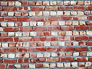 Industrial bricklayer installing bricks on construction site.