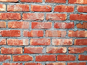 Industrial bricklayer installing bricks on construction site.