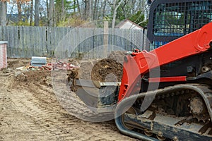 industrial building construction site mini bulldozer levelling and moving soil