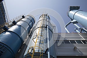 Industrial building, the dust collector with clear blue sky background