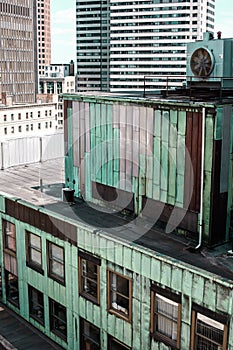 Industrial building with tarnished green and silver metal exterior